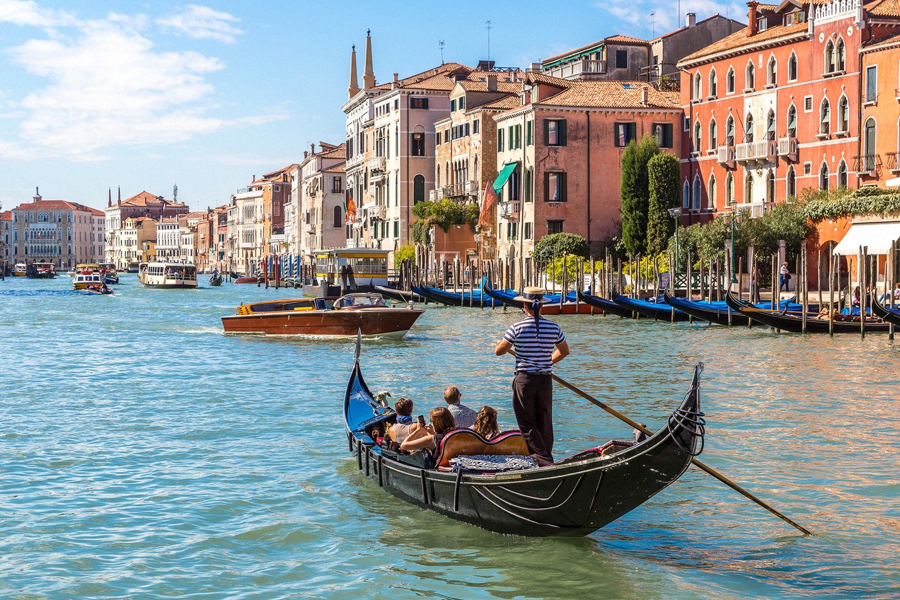Gondola with tourists on the Grand Canal